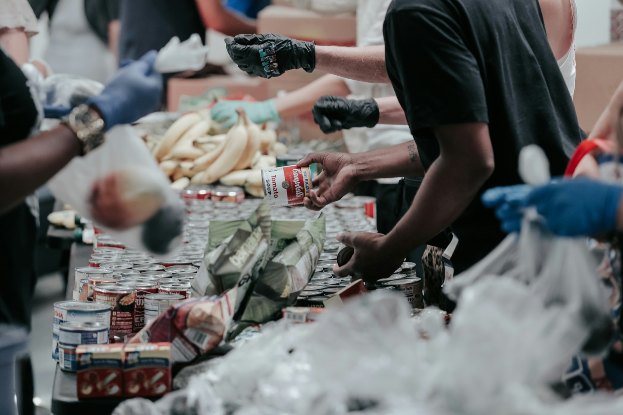 Volunteers handing out food at a community food drive
