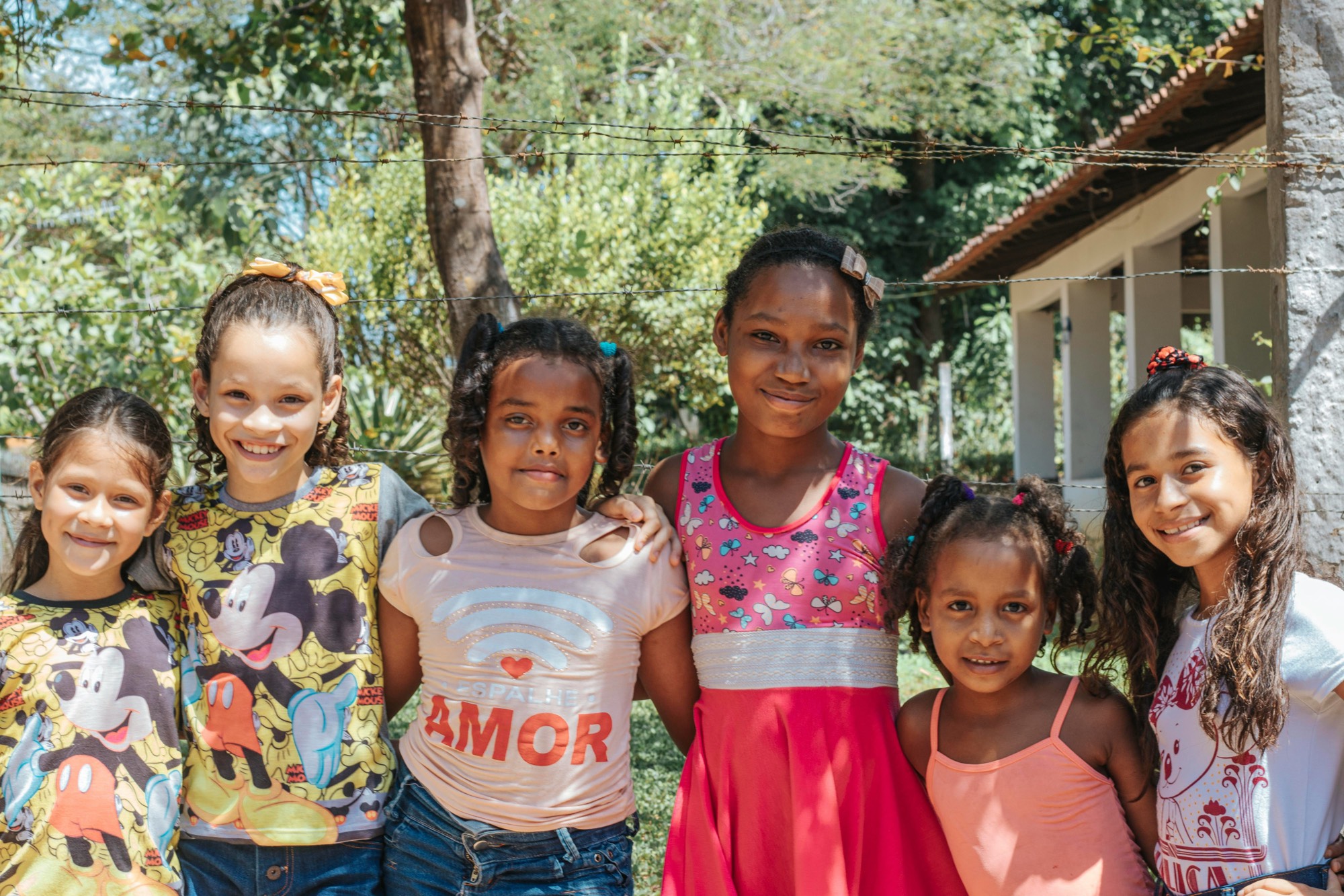Smiling children standing together outdoors